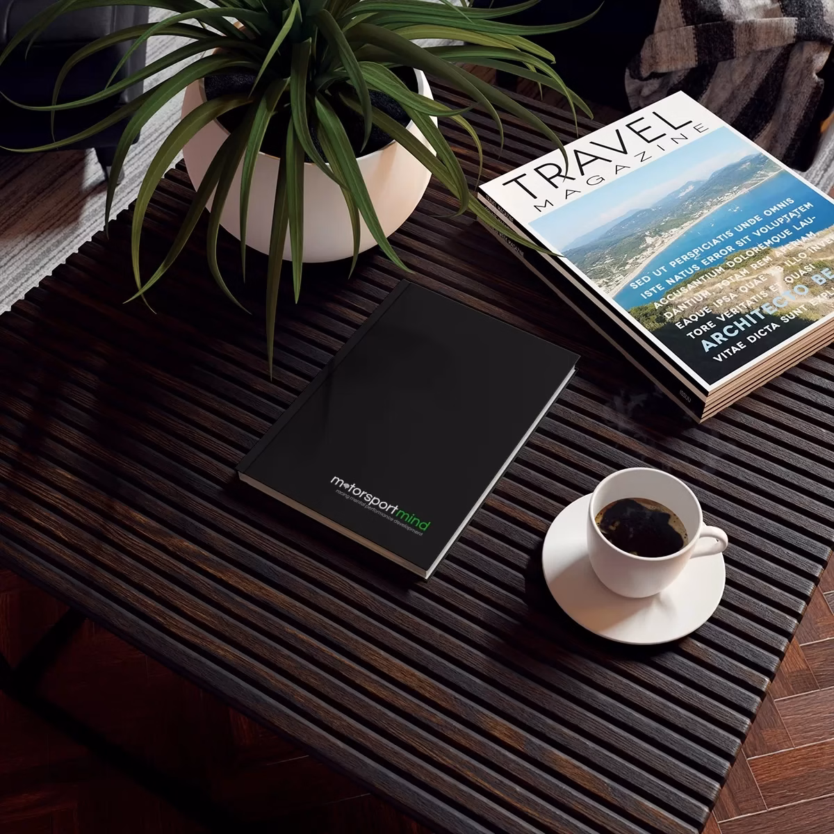 A Hard Backed Journal on a table next to a cup of coffee.