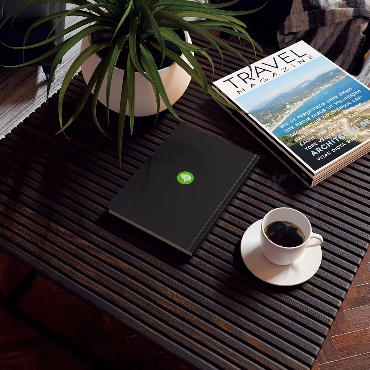 A Hard Backed Journal on a table next to a cup of coffee.