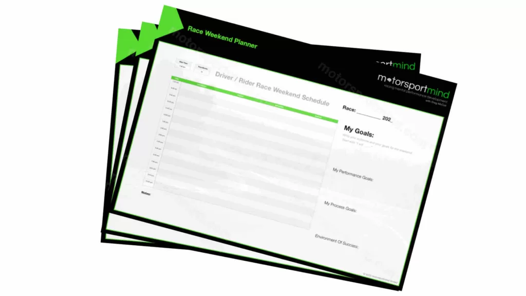 A stack of green and black business cards on a white background.